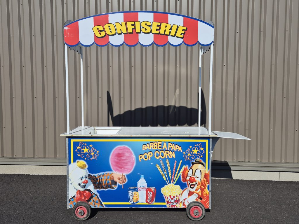 Charrette CONFISERIE cirque bleue avec clowns et pop-corn.